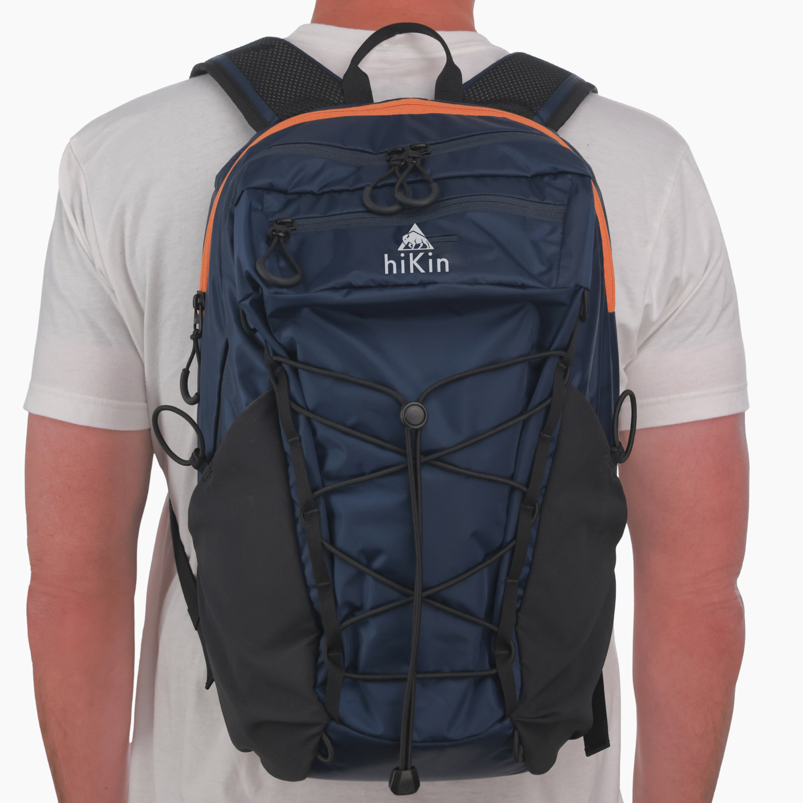 Back view of a hiker wearing the navy Rim2Rim Pack