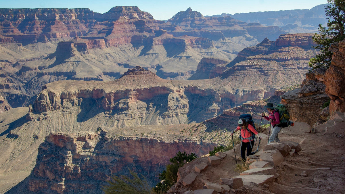 Hikers descending the South Kaibab Trail below the South Rim of Grand Canyon.
