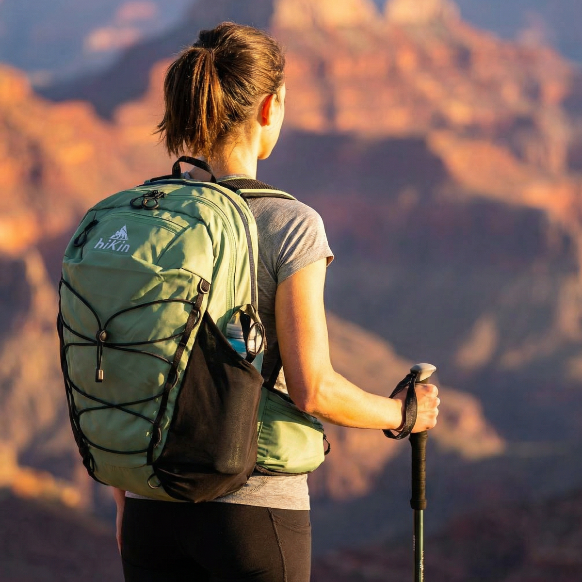 Hiker wearing a hiKin pack on the trail