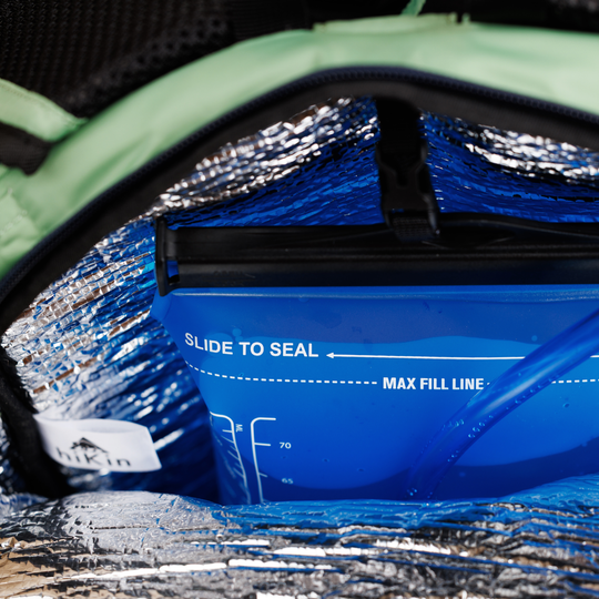 Hydration reservoir stored inside the insulated compartment of the sage green Canyon Elite 25 pack