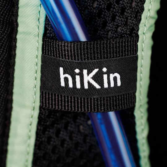 Close-up of the hydration-tube holder on the Canyon Elite 25 shoulder strap